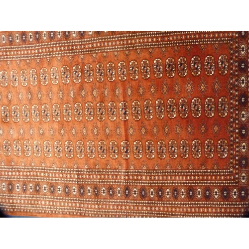 477 - Bokhara rug on red ground.