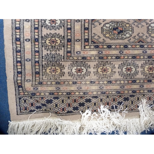 478 - Turkish Bokhara rug on cream ground.