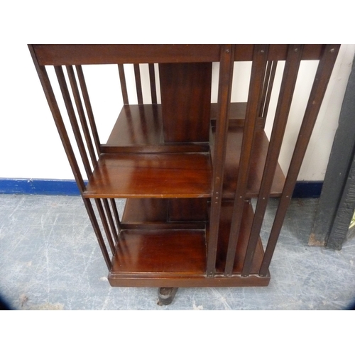 480 - Mahogany revolving bookcase on platform base and castors.