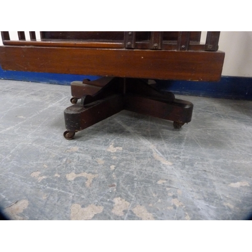 480 - Mahogany revolving bookcase on platform base and castors.