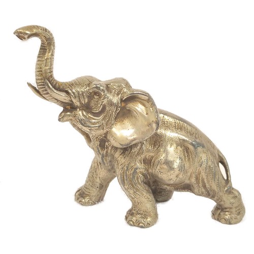 White metal elephant and bronze duck.