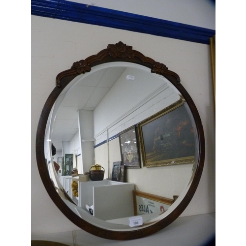 104 - Two circular wall mirrors and a pair of brass Egyptian wall plaques.