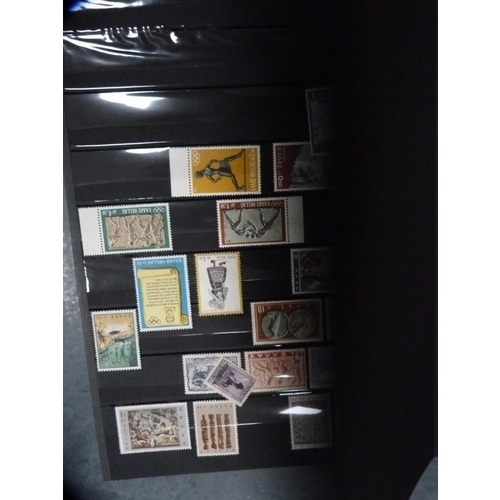 182 - Folders containing assorted world stamps.