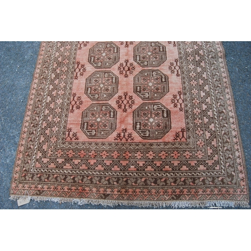 299 - Antique Afghan hand-knotted rug with two rows of four geometric octagonal medallions interspersed by... 