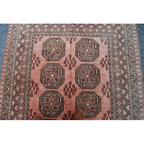 299 - Antique Afghan hand-knotted rug with two rows of four geometric octagonal medallions interspersed by... 