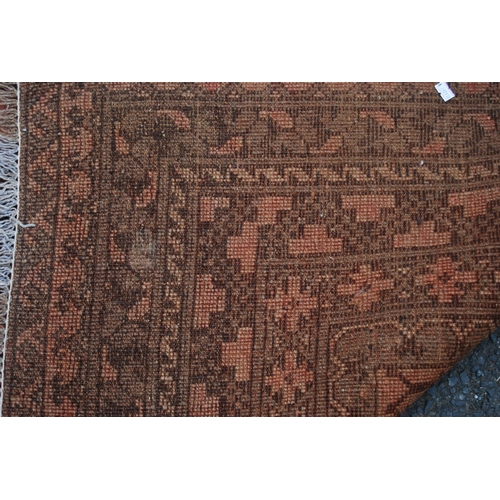 299 - Antique Afghan hand-knotted rug with two rows of four geometric octagonal medallions interspersed by... 