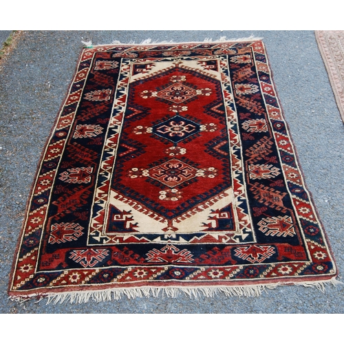 300 - Turkish hand-knotted rug with three geometric lozenges to the centre, further geometric medallions a... 