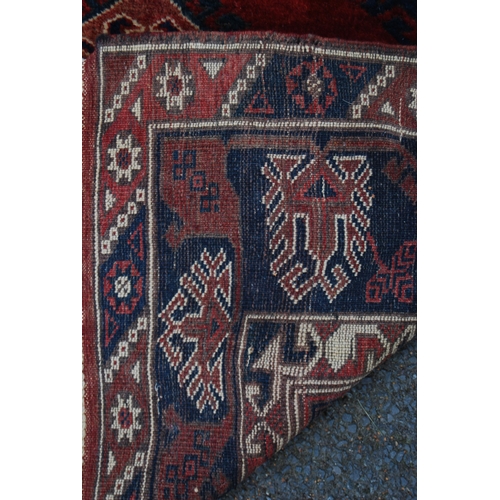 300 - Turkish hand-knotted rug with three geometric lozenges to the centre, further geometric medallions a... 