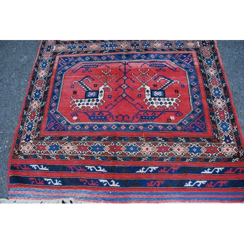 301 - Turkish Milas hand-knotted rug with two panels of nomadic animals within geometric motifs and guls, ... 