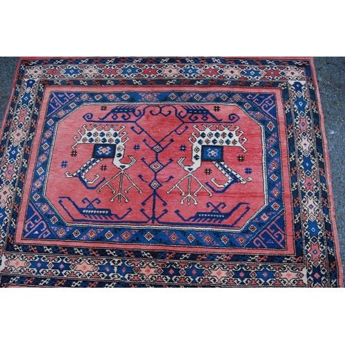 301 - Turkish Milas hand-knotted rug with two panels of nomadic animals within geometric motifs and guls, ... 