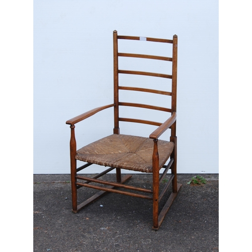 353 - In the Manner of LibertyArts and Crafts ash and elm ladder-back elbow chair with shaped armrests, wo... 