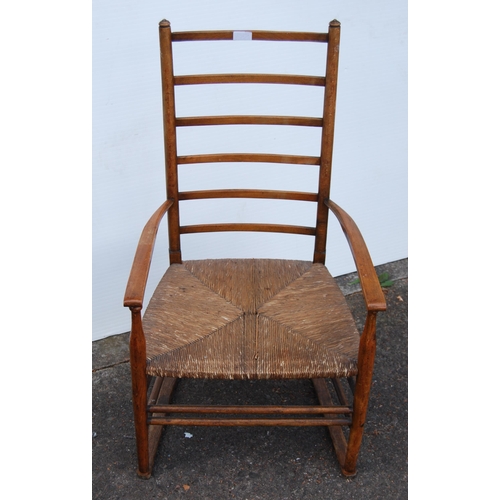 353 - In the Manner of LibertyArts and Crafts ash and elm ladder-back elbow chair with shaped armrests, wo... 