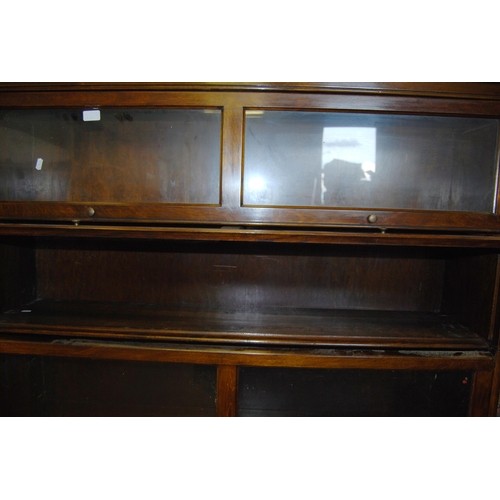 354 - American mahogany sectional bookcase of five sections with pull-up detachable glazed doors, 186cm hi... 