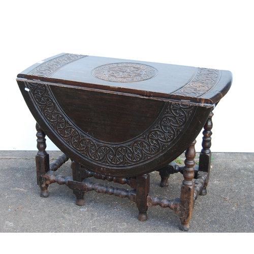 356 - Antique oak gateleg supper table in the Charles II style, with all over banding of motifs to the top... 