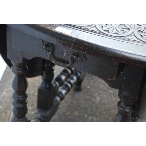 356 - Antique oak gateleg supper table in the Charles II style, with all over banding of motifs to the top... 