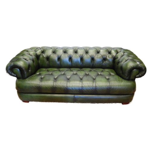 357 - Chesterfield club-style green three-seater sofa and a matching armchair, sofa approximately 60cm hig... 