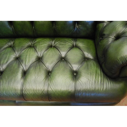 357 - Chesterfield club-style green three-seater sofa and a matching armchair, sofa approximately 60cm hig... 