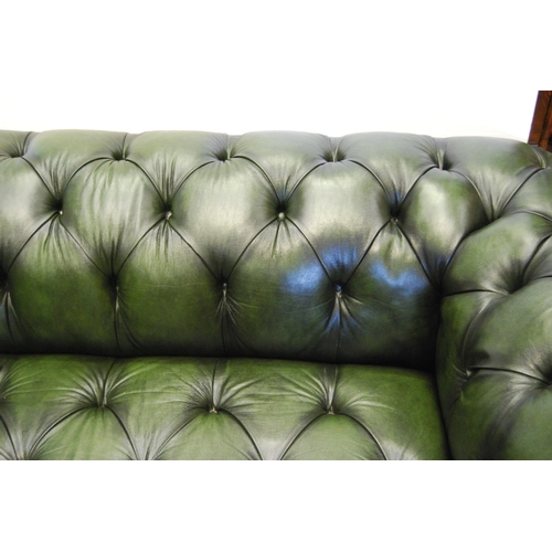 357 - Chesterfield club-style green three-seater sofa and a matching armchair, sofa approximately 60cm hig... 