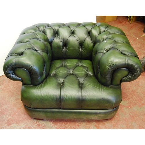 357 - Chesterfield club-style green three-seater sofa and a matching armchair, sofa approximately 60cm hig... 