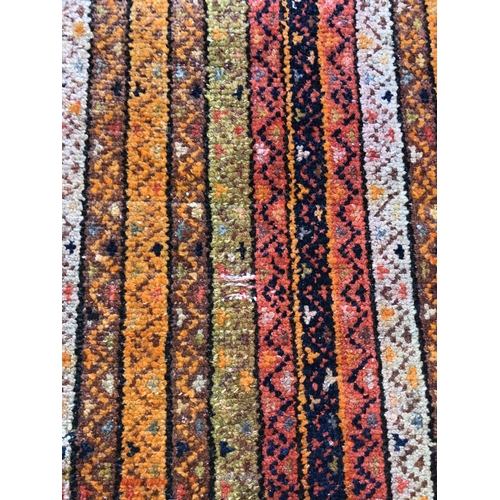 489 - Shaal runner, field with polychrome and geometric columns within foliate borders, 437cm x 87cm.