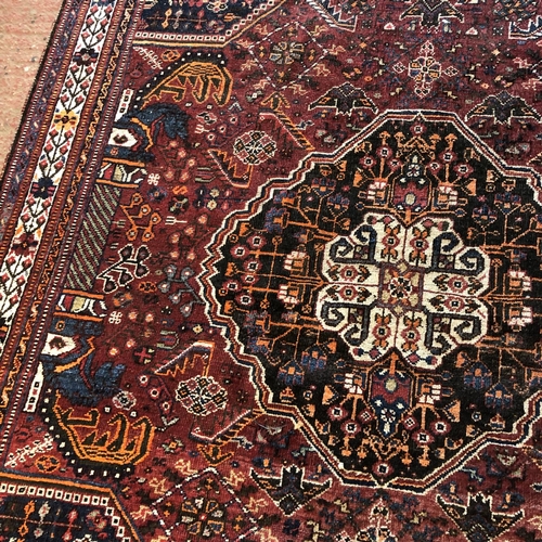 490 - Caucasian rug, with central medallion flanked by palm topped columns within foliate field and border... 