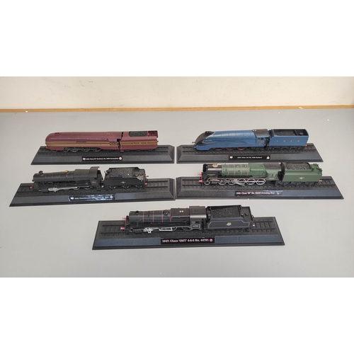 111 - Five collectors model trains on stands to include BR Class 5MT 4-6-0, BR Class 9F Evening Star, LNER... 