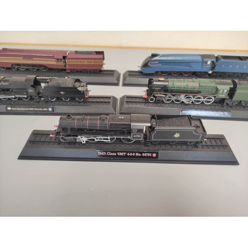 111 - Five collectors model trains on stands to include BR Class 5MT 4-6-0, BR Class 9F Evening Star, LNER... 