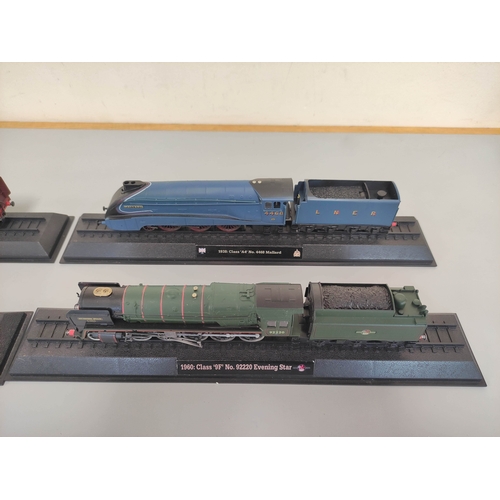 111 - Five collectors model trains on stands to include BR Class 5MT 4-6-0, BR Class 9F Evening Star, LNER... 