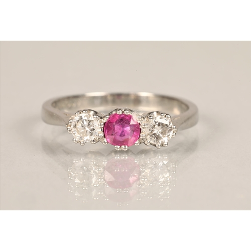 104 - Ladies platinum diamond & ruby ring, central ruby 0.5 carat with a 0.5 carat diamond on either s... 