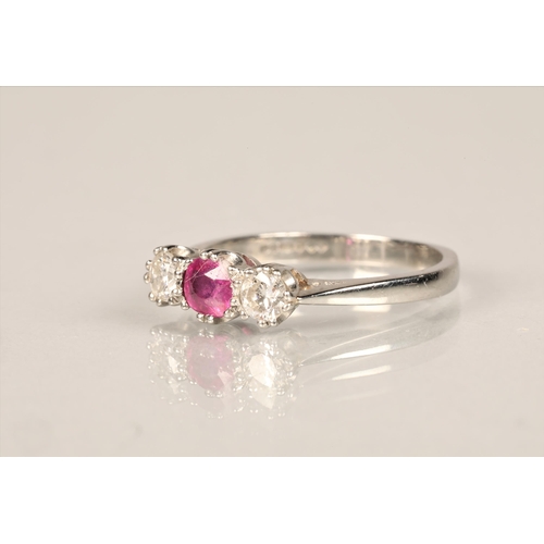 104 - Ladies platinum diamond & ruby ring, central ruby 0.5 carat with a 0.5 carat diamond on either s... 