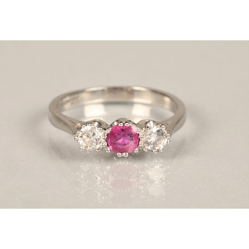 104 - Ladies platinum diamond & ruby ring, central ruby 0.5 carat with a 0.5 carat diamond on either s... 