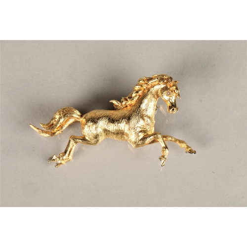 110 - Ladies 18ct yellow gold brooch in the form of a prancing horse, set with a diamond chip eye, 11g