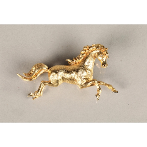 110 - Ladies 18ct yellow gold brooch in the form of a prancing horse, set with a diamond chip eye, 11g