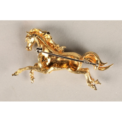 110 - Ladies 18ct yellow gold brooch in the form of a prancing horse, set with a diamond chip eye, 11g