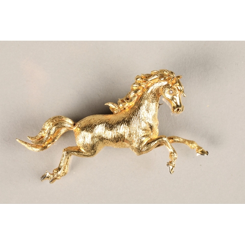 110 - Ladies 18ct yellow gold brooch in the form of a prancing horse, set with a diamond chip eye, 11g