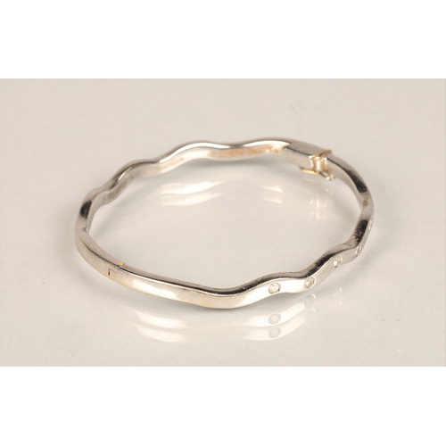 113 - Ladies 18ct white gold stiff bangle, set with five small diamonds, weight 27g