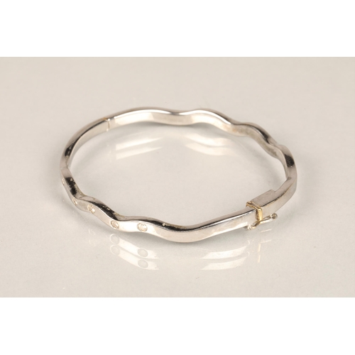 113 - Ladies 18ct white gold stiff bangle, set with five small diamonds, weight 27g