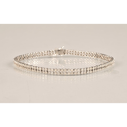 115 - Ladies 9k white gold diamond bracelet, set with two rows of small diamonds, length 19.5cm