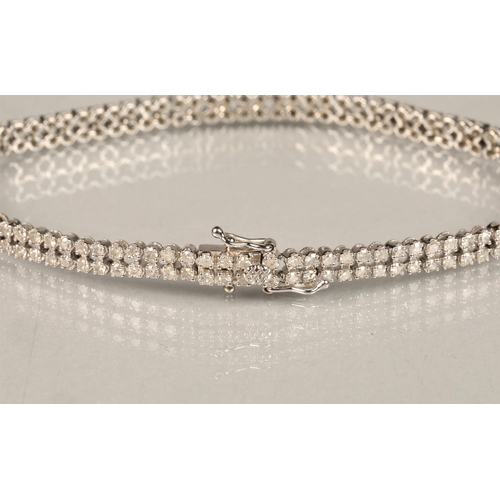 115 - Ladies 9k white gold diamond bracelet, set with two rows of small diamonds, length 19.5cm