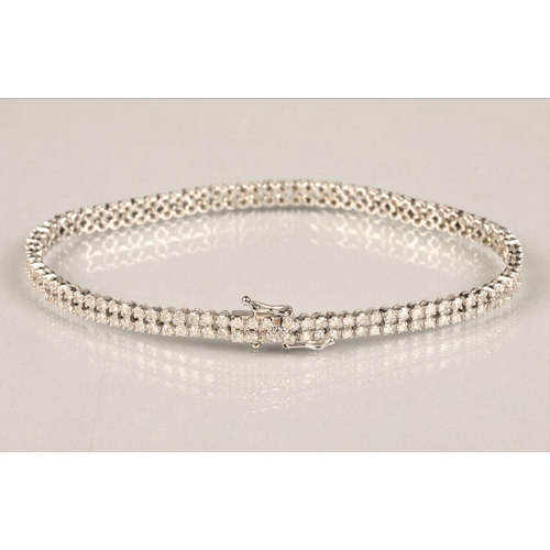 115 - Ladies 9k white gold diamond bracelet, set with two rows of small diamonds, length 19.5cm