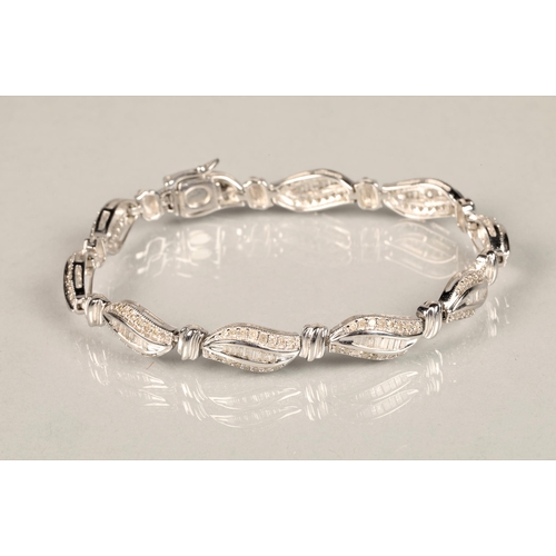 116 - Ladies 9ct white gold diamond bracelet, each link with brilliant and baguette cut diamonds, length 1... 