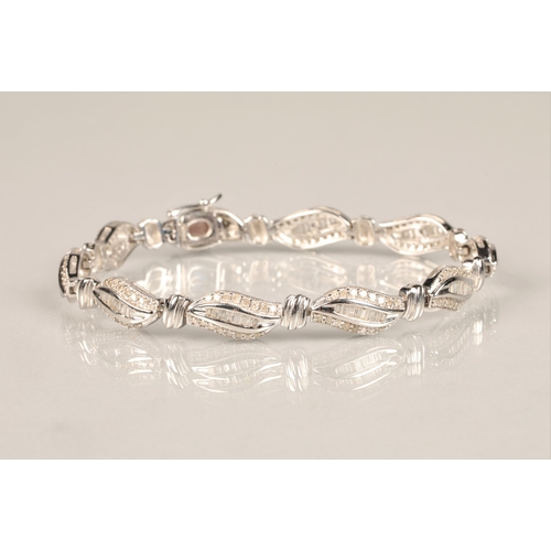 116 - Ladies 9ct white gold diamond bracelet, each link with brilliant and baguette cut diamonds, length 1... 