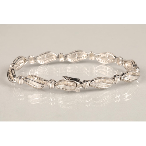 116 - Ladies 9ct white gold diamond bracelet, each link with brilliant and baguette cut diamonds, length 1... 