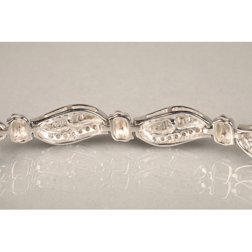 116 - Ladies 9ct white gold diamond bracelet, each link with brilliant and baguette cut diamonds, length 1... 