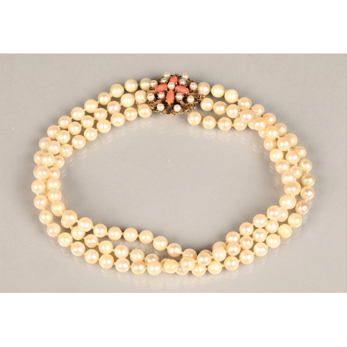 122 - Three strand pearl necklace with an ornate 9ct yellow gold, coral and seed pearl clasp, length 35.5c... 