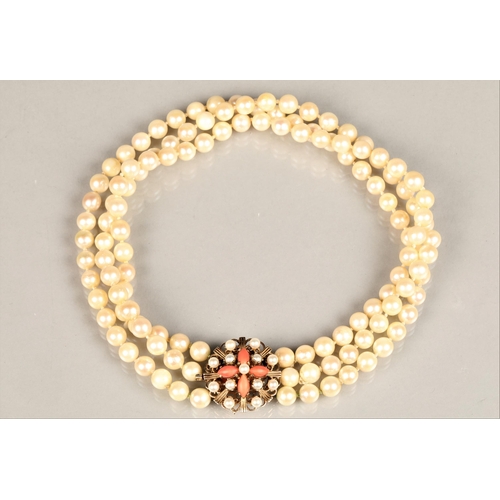 122 - Three strand pearl necklace with an ornate 9ct yellow gold, coral and seed pearl clasp, length 35.5c... 