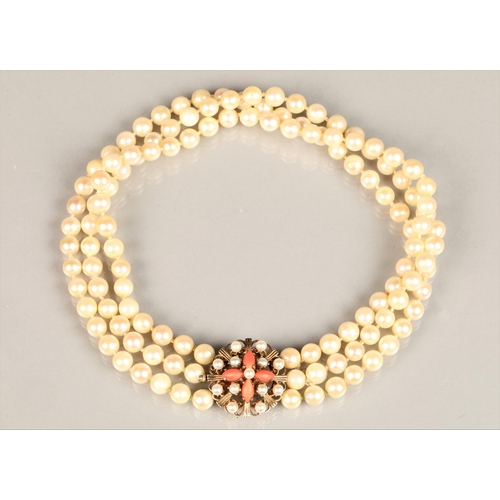 122 - Three strand pearl necklace with an ornate 9ct yellow gold, coral and seed pearl clasp, length 35.5c... 