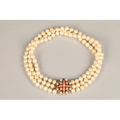 122 - Three strand pearl necklace with an ornate 9ct yellow gold, coral and seed pearl clasp, length 35.5c... 