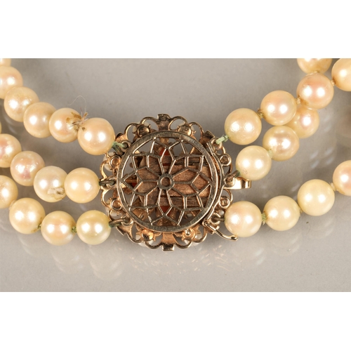 122 - Three strand pearl necklace with an ornate 9ct yellow gold, coral and seed pearl clasp, length 35.5c... 