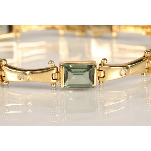 123 - Ladies 18ct yellow gold diamond and green gem stone bracelet with matching pair of earrings, length ... 